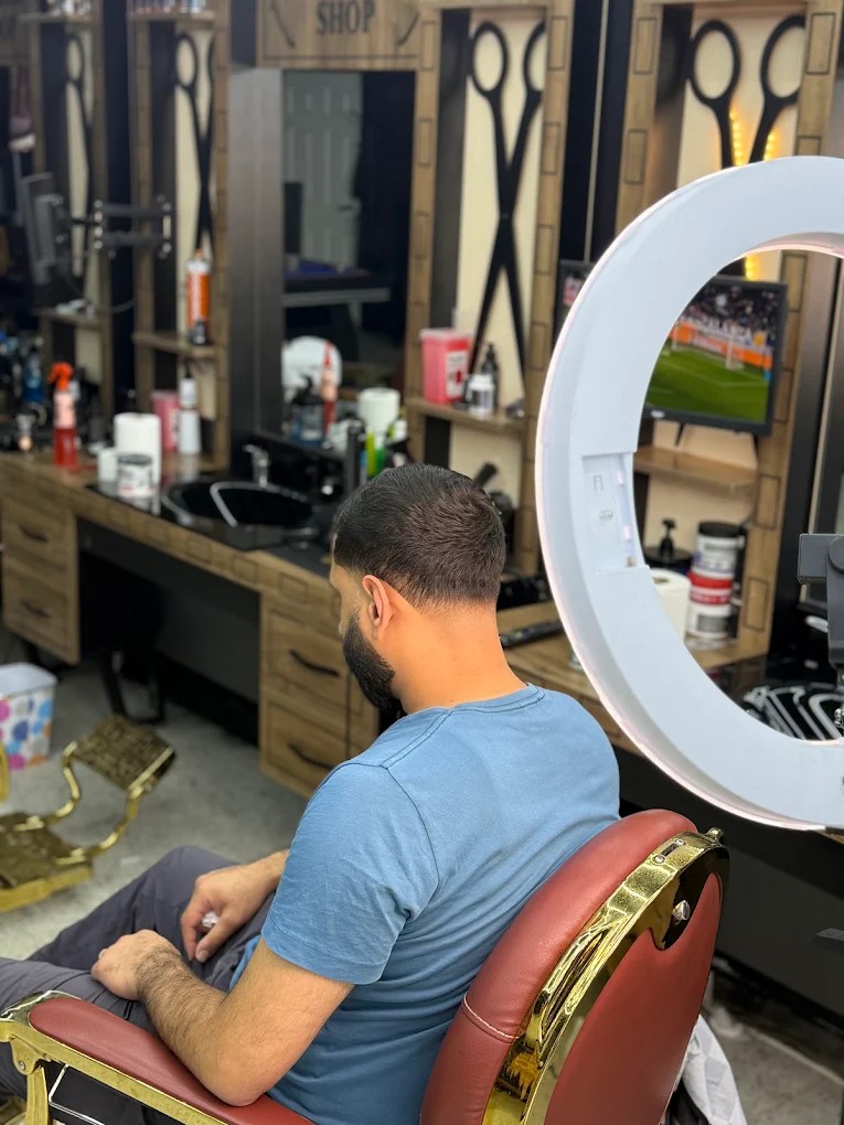 APO's Barbershop interior — gold chairs, wooden panels, Birmingham